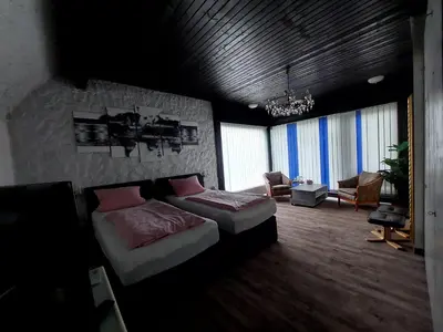 Ein Bett oder Betten in einem Zimmer der Unterkunft Am Hallenbad Hotel garni