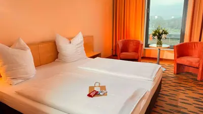 Ein Bett oder Betten in einem Zimmer der Unterkunft Hotel Rhein-Ruhr Bottrop