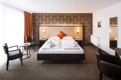 Ein Bett oder Betten in einem Zimmer der Unterkunft Hotel Plaza