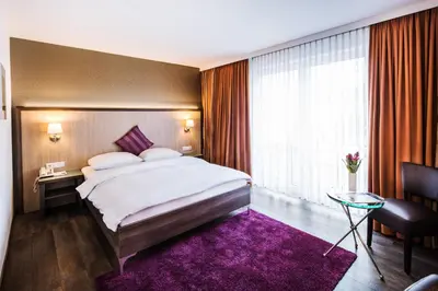 Ein Bett oder Betten in einem Zimmer der Unterkunft Hotel Plaza