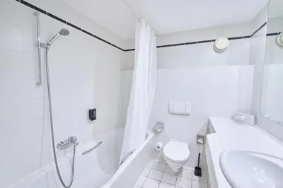 Ein Badezimmer in der Unterkunft Hotel Plaza