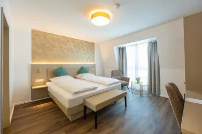 Ein Bett oder Betten in einem Zimmer der Unterkunft Hotel Plaza