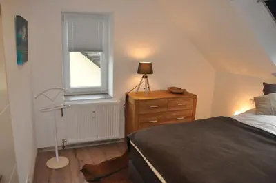Ein Bett oder Betten in einem Zimmer der Unterkunft Sterner Obgruiten