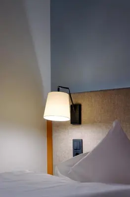 Ein Bett oder Betten in einem Zimmer der Unterkunft Hotel am Kloster