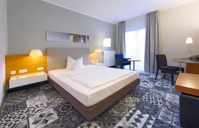Ein Bett oder Betten in einem Zimmer der Unterkunft Hotel am Kloster