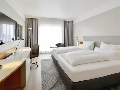 Ein Bett oder Betten in einem Zimmer der Unterkunft Mercure Kamen Unna