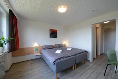 Ein Bett oder Betten in einem Zimmer der Unterkunft Ruhrpottpension Am Stöter