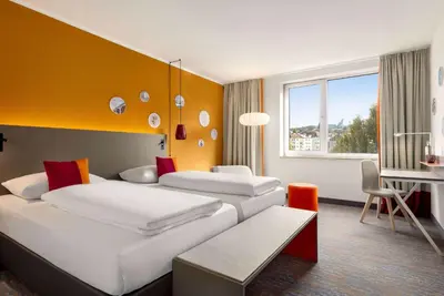 Ein Bett oder Betten in einem Zimmer der Unterkunft Vienna House Easy by Wyndham Wuppertal