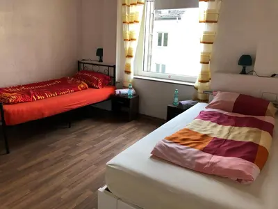 Ein Bett oder Betten in einem Zimmer der Unterkunft M/P