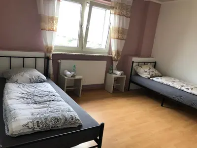 Ein Bett oder Betten in einem Zimmer der Unterkunft M/P