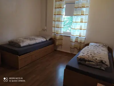 Ein Bett oder Betten in einem Zimmer der Unterkunft M/P