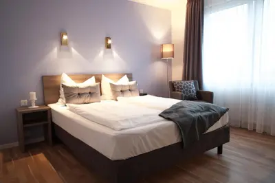 Ein Bett oder Betten in einem Zimmer der Unterkunft Kempe Komfort plus Hotel
