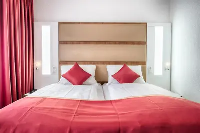 Ein Bett oder Betten in einem Zimmer der Unterkunft Hotel Senator