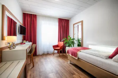 Ein Bett oder Betten in einem Zimmer der Unterkunft Hotel Senator