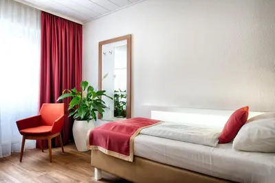 Ein Bett oder Betten in einem Zimmer der Unterkunft Hotel Senator