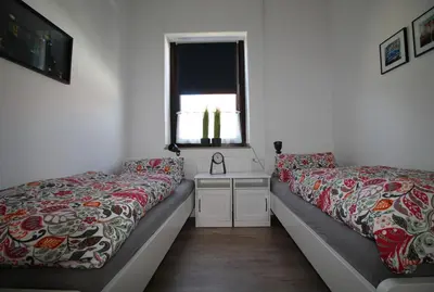 Ein Bett oder Betten in einem Zimmer der Unterkunft Ferienwohnung 14.sechs - Jahrhundertwende trifft Moderne