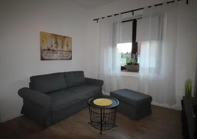 Ein Sitzbereich in der Unterkunft Ferienwohnung 14.sechs - Jahrhundertwende trifft Moderne