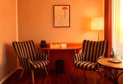 Ein Sitzbereich in der Unterkunft Hotel Ambiente