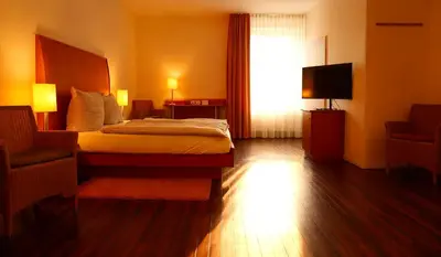 Ein Bett oder Betten in einem Zimmer der Unterkunft Hotel Ambiente