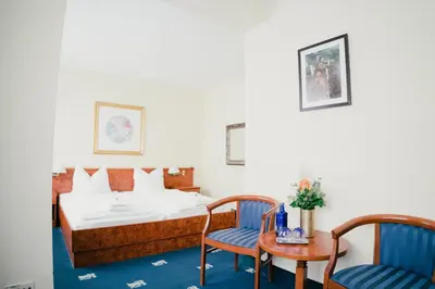 Ein Bett oder Betten in einem Zimmer der Unterkunft Altstadt Hotel St. Georg
