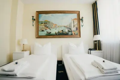 Ein Bett oder Betten in einem Zimmer der Unterkunft Altstadt Hotel St. Georg