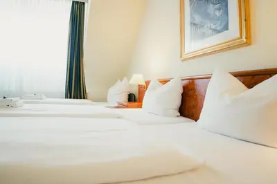 Ein Bett oder Betten in einem Zimmer der Unterkunft Altstadt Hotel St. Georg