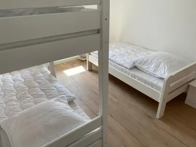 Ein Bett oder Betten in einem Zimmer der Unterkunft interaktiv Appartements in Heiligenhaus - Hauptstrasse