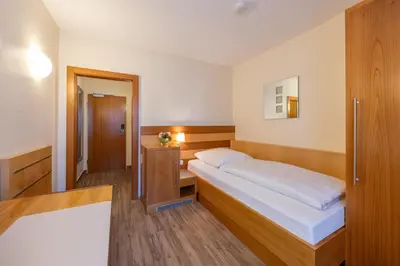 Ein Bett oder Betten in einem Zimmer der Unterkunft Hotel Carlton