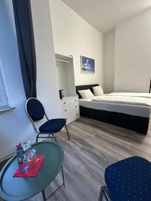 Ein Bett oder Betten in einem Zimmer der Unterkunft Hotel Astor