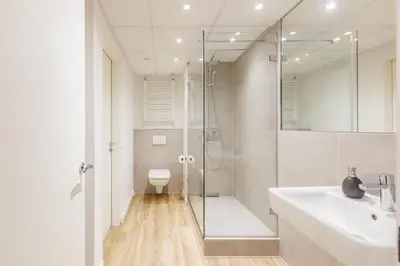 Ein Badezimmer in der Unterkunft Glück Auf Appartements Düppelstraße