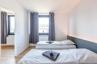 Ein Bett oder Betten in einem Zimmer der Unterkunft Glück Auf Appartements Düppelstraße