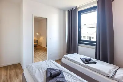 Ein Bett oder Betten in einem Zimmer der Unterkunft Glück Auf Appartements Düppelstraße