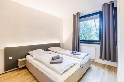 Ein Bett oder Betten in einem Zimmer der Unterkunft Glück Auf Appartements Düppelstraße