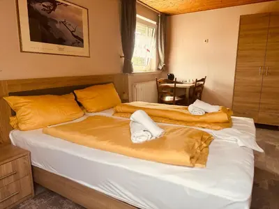 Ein Bett oder Betten in einem Zimmer der Unterkunft Hotel-Restaurant Olympia