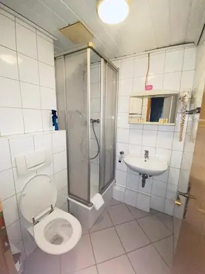 Ein Badezimmer in der Unterkunft Hotel-Restaurant Olympia