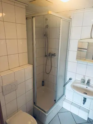Ein Badezimmer in der Unterkunft Hotel-Restaurant Olympia