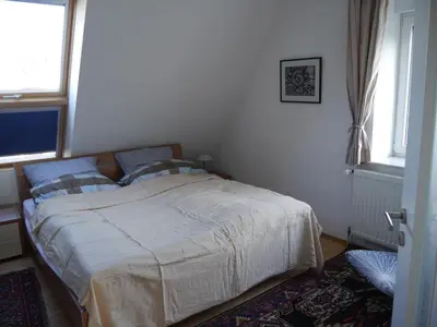 Ein Bett oder Betten in einem Zimmer der Unterkunft FeWo BlumenPott