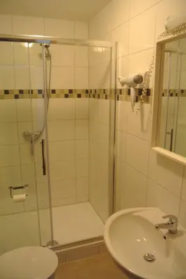 Ein Badezimmer in der Unterkunft Hotel Am Kamin