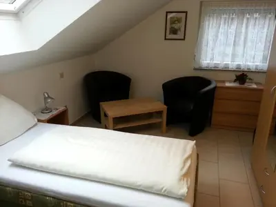 Ein Bett oder Betten in einem Zimmer der Unterkunft Hotel Am Kamin