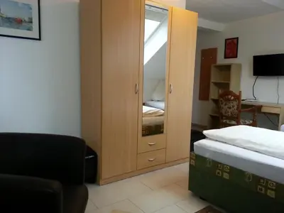 Ein Bett oder Betten in einem Zimmer der Unterkunft Hotel Am Kamin