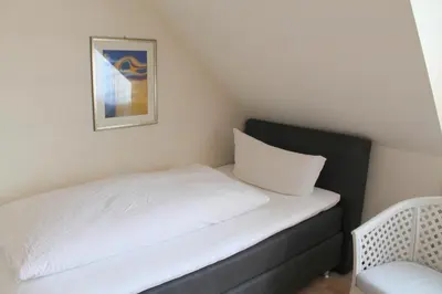 Ein Bett oder Betten in einem Zimmer der Unterkunft Haus Kastanienhof