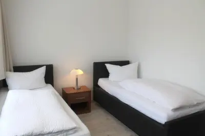 Ein Bett oder Betten in einem Zimmer der Unterkunft Haus Kastanienhof
