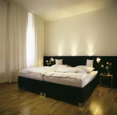 Ein Bett oder Betten in einem Zimmer der Unterkunft Hotel Lorenz