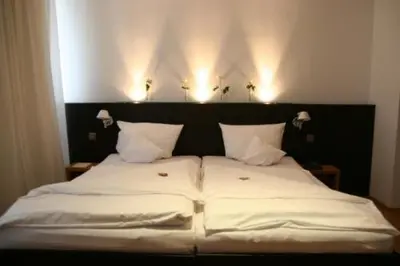 Ein Bett oder Betten in einem Zimmer der Unterkunft Hotel Lorenz