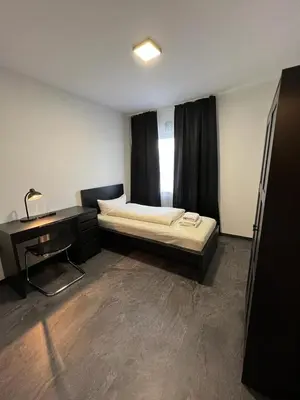 Ein Bett oder Betten in einem Zimmer der Unterkunft Hotel Dümptener Hof