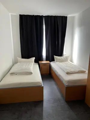 Ein Bett oder Betten in einem Zimmer der Unterkunft Hotel Dümptener Hof