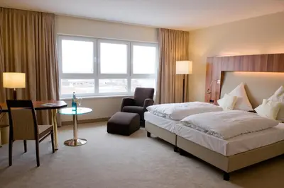 Ein Bett oder Betten in einem Zimmer der Unterkunft Ringhotel Katharinen Hof