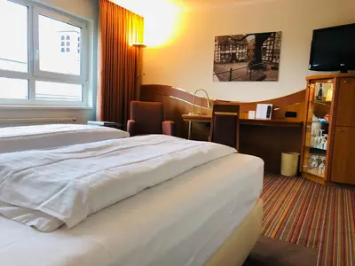 Ein Bett oder Betten in einem Zimmer der Unterkunft Ringhotel Katharinen Hof