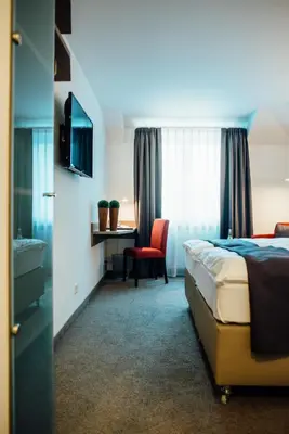 Ein Bett oder Betten in einem Zimmer der Unterkunft Hotel Schmachtendorf