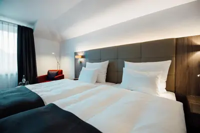 Ein Bett oder Betten in einem Zimmer der Unterkunft Hotel Schmachtendorf